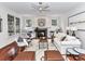 Bright living room featuring a fireplace, built-in shelving, and a stylish rug at 8921 Magnolia Heights Ct, Charlotte, NC 28270