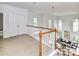 Upstairs loft area with view to lower level living space with lots of natural light at 8921 Magnolia Heights Ct, Charlotte, NC 28270