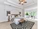 Spacious main bedroom with a tray ceiling, sitting area, and decorative accents at 8921 Magnolia Heights Ct, Charlotte, NC 28270