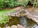 Backyard koi pond and waterfall feature at 8921 Magnolia Heights Ct, Charlotte, NC 28270