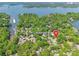 Aerial view of 9012 Windjammer Drive in lakeside neighborhood with greenery and picturesque marina at 9012 Windjammer Dr, Tega Cay, SC 29708