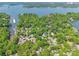 Gorgeous aerial shot of a lakeside neighborhood featuring lush greenery and a picturesque marina at 9012 Windjammer Dr, Tega Cay, SC 29708