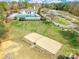 Community sand volleyball court, park, and pool with picnic tables and green space at 9012 Windjammer Dr, Tega Cay, SC 29708