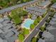 Aerial view of community pool area with brick townhomes and landscaped greenery at 984 Park Slope Dr, Charlotte, NC 28209