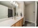 Bathroom featuring a light wood vanity with a white countertop and a large mirror at 984 Park Slope Dr, Charlotte, NC 28209