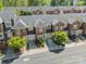 A birds-eye view of brick townhomes with well-manicured lawns and attached garages in a desirable neighborhood at 984 Park Slope Dr, Charlotte, NC 28209