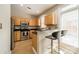 Kitchen featuring stainless steel appliances and breakfast bar with barstools at 984 Park Slope Dr, Charlotte, NC 28209