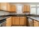 Close up of L-shaped kitchen with stainless steel appliances and granite countertops at 984 Park Slope Dr, Charlotte, NC 28209