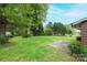 Spacious backyard with mature trees and well-maintained lawn, perfect for outdoor activities and relaxation at 1025 Hefner Nw Dr, Conover, NC 28613