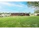 Expansive green backyard, offering ample space for recreation with privacy fencing and distant views at 1025 Hefner Nw Dr, Conover, NC 28613