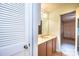 A quaint bathroom featuring a vanity with a large mirror and plenty of cabinet space for storage at 1025 Hefner Nw Dr, Conover, NC 28613