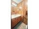 Powder room with vanity and wood paneled walls at 1025 Hefner Nw Dr, Conover, NC 28613
