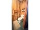 Powder room with toilet and wood paneled walls at 1025 Hefner Nw Dr, Conover, NC 28613