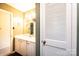 This bathroom features a vanity with storage space, a mirror, and adjacent closet for organizing at 1025 Hefner Nw Dr, Conover, NC 28613
