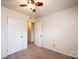 A bright bedroom with a ceiling fan and a closet for storage and access to the rest of the home at 1025 Hefner Nw Dr, Conover, NC 28613
