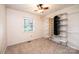 This bedroom features a ceiling fan, good natural light, and an adjustable closet organization system at 1025 Hefner Nw Dr, Conover, NC 28613