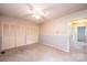 A bright bedroom with a ceiling fan and a large closet with bi-fold doors for ample storage at 1025 Hefner Nw Dr, Conover, NC 28613