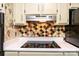 Modern kitchen with a glass cooktop and colorful backsplash at 1025 Hefner Nw Dr, Conover, NC 28613
