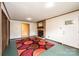 Cozy living room featuring brick fireplace and an adjacent doorway at 1025 Hefner Nw Dr, Conover, NC 28613