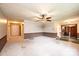 Large living room with neutral walls, a ceiling fan, and views into other rooms, ready for personalization at 1025 Hefner Nw Dr, Conover, NC 28613