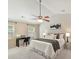 Primary bedroom with vaulted ceiling, ceiling fan, neutral carpet and walls at 104 Aurora Ln, Huntersville, NC 28078