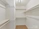 Walk-in closet with shelving and carpet flooring at 104 Aurora Ln, Huntersville, NC 28078