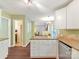 Open kitchen design with white cabinetry, granite counters, and stainless steel appliances at 104 Aurora Ln, Huntersville, NC 28078