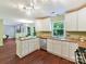 Bright kitchen with white cabinets, granite countertops, and stainless steel dishwasher at 104 Aurora Ln, Huntersville, NC 28078