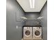 Modern laundry room featuring a gray walls, modern washer and dryer, and utility sink at 104 Aurora Ln, Huntersville, NC 28078
