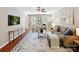 Spacious living room with contemporary decor, ceiling fan and lots of seating at 104 Aurora Ln, Huntersville, NC 28078