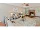 Cozy living room with fireplace, neutral tones, and plenty of natural light at 104 Aurora Ln, Huntersville, NC 28078