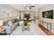 Comfortable living room features a brick fireplace and backyard access at 104 Aurora Ln, Huntersville, NC 28078