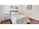 Comfortable bedroom with a neutral color scheme, artwork and wood flooring at 105 Runningdeer Dr, Mooresville, NC 28117
