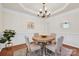 Formal dining room with hardwood floors, wainscoting and a chandelier at 105 Runningdeer Dr, Mooresville, NC 28117