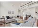 Spacious living room featuring soaring ceilings, hardwood floors, and comfortable seating at 105 Runningdeer Dr, Mooresville, NC 28117