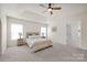 Neutral main bedroom featuring carpet, natural lighting, and a calming color scheme at 105 Runningdeer Dr, Mooresville, NC 28117