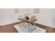 Home office featuring a modern desk, chair, neutral walls, and laminate flooring with natural light at 105 Runningdeer Dr, Mooresville, NC 28117