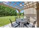 Outdoor patio with wooden pergola over a table and chairs, perfect for dining at 105 Runningdeer Dr, Mooresville, NC 28117
