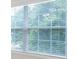 Close-up of window with blinds, view of tree in background at 105 Runningdeer Dr, Mooresville, NC 28117