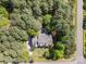 Aerial shot showcasing the property's location surrounded by mature trees, neighborhood, and well manicured landscaping at 108 Bare Foot Ln, Mooresville, NC 28117