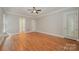 Spacious bedroom with hardwood floors, balcony access and neutral wall color at 108 Bare Foot Ln, Mooresville, NC 28117
