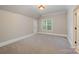 Bright bedroom with neutral carpet and a window that allows natural light to enter at 108 Bare Foot Ln, Mooresville, NC 28117