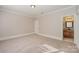 Neutral bedroom with carpet flooring and bathroom access at 108 Bare Foot Ln, Mooresville, NC 28117