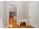 Welcoming entryway with a built-in bench and coat hooks next to the front door at 108 Bare Foot Ln, Mooresville, NC 28117