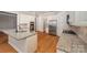 Spacious kitchen with stainless steel appliances, granite countertops, and white cabinetry at 108 Bare Foot Ln, Mooresville, NC 28117