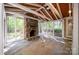 Sunroom featuring a stone fireplace, tile flooring, and lots of light at 108 Bare Foot Ln, Mooresville, NC 28117