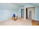 This home attic has a door to a closet and is painted a light shade of blue at 109 Terrace Pl, Lincolnton, NC 28092
