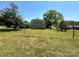 Expansive backyard featuring lush green grass and mature trees, offering a serene outdoor space at 109 Terrace Pl, Lincolnton, NC 28092