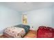 Bedroom featuring natural light and wooden floors at 109 Terrace Pl, Lincolnton, NC 28092