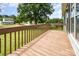 View of the deck overlooking the home's back yard with lush green grass at 109 Terrace Pl, Lincolnton, NC 28092